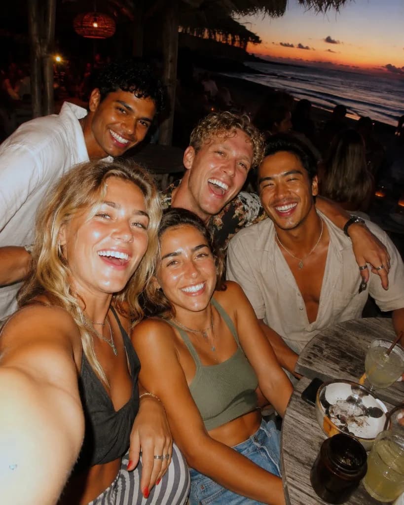 Group of Travelers sharing a sunset moment together